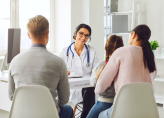 family talking to a female doctor