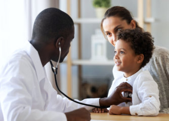 doctor examining a child's chest with a stethoscope