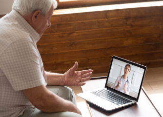 senior consulting with doctor via video call