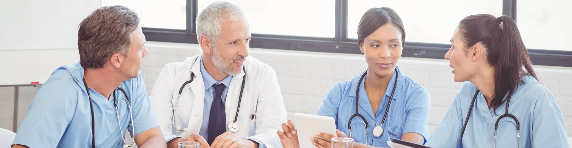 nurses and doctor talking