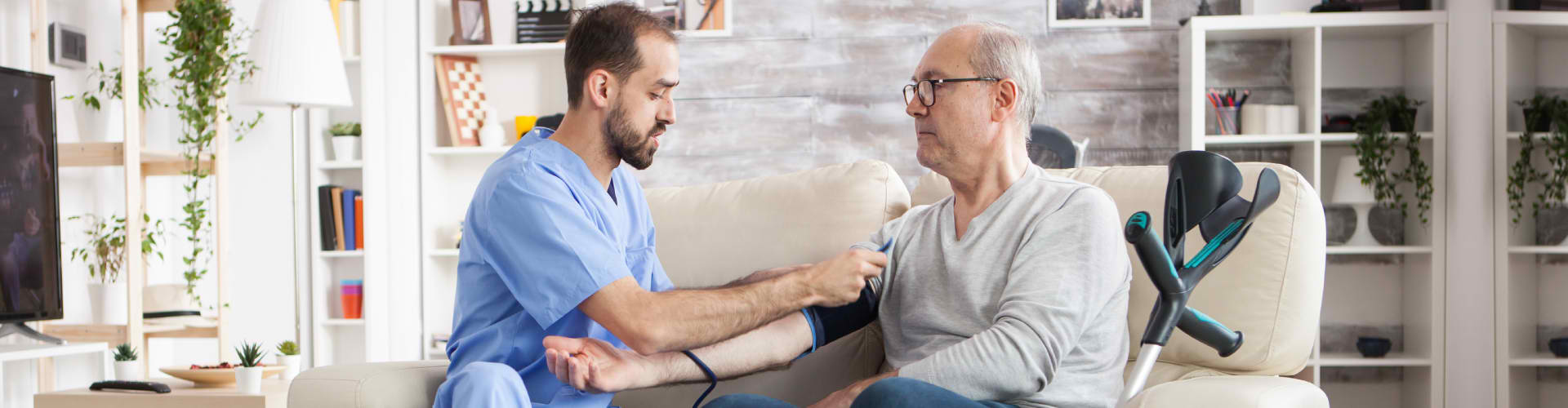 nurse preparing blood pressure monitor for patient